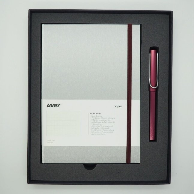 Комплект: Ручка-роллер Lamy Al-star Пурпурный, Записная книжка, твердый переплет, А5, пурпурный Комплект: Ручка-роллер Lamy Al-star Пурпурный, Записная книжка, твердый переплет, А5, пурпурный